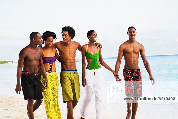 African friends walking on beach