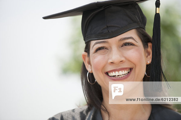 Smiling Hispanic graduate