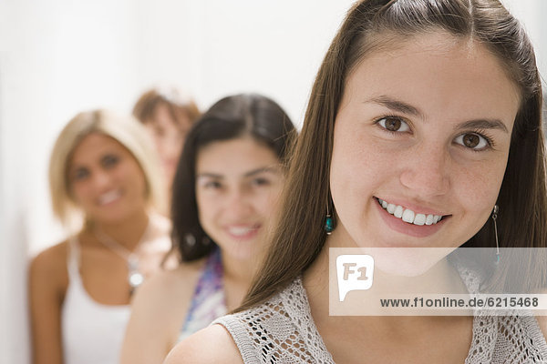 Hispanic woman and friends smiling