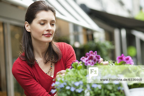 Woman looking at flowers in a flower shop