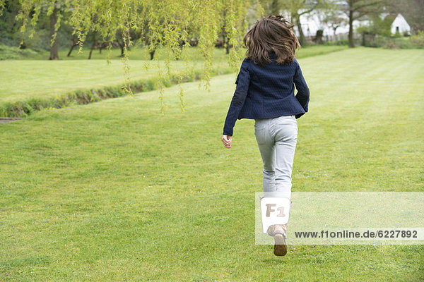 Girl running in a field