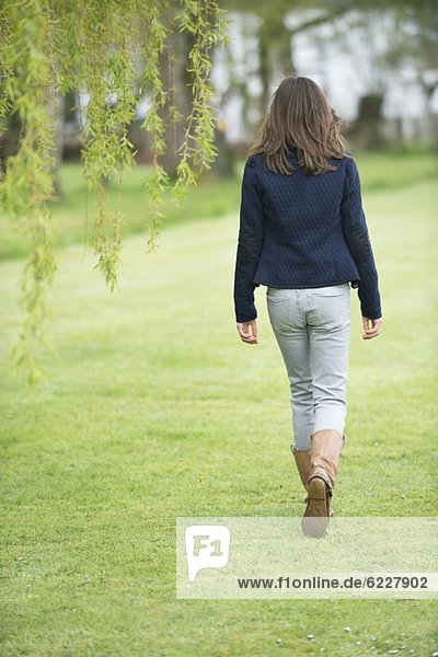 Girl walking in a field
