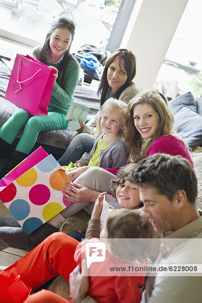 Happy family sitting together at home