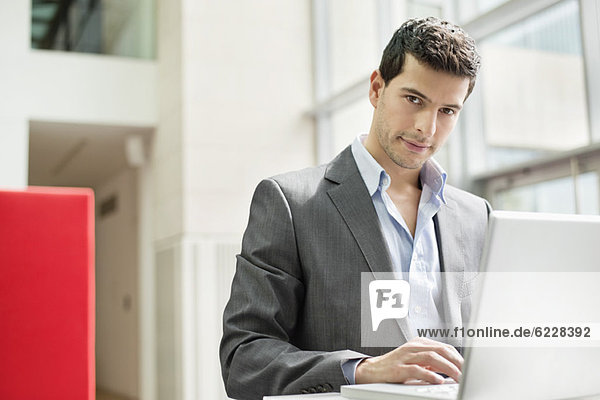 Businessman working on a laptop in an office