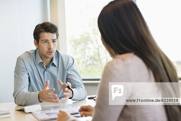 Business executive discussing with his client