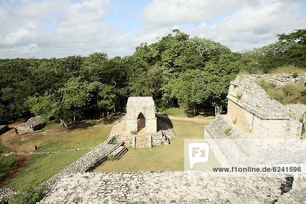 The Entrance Arch in the centre with one of the Twin Pyramids to the right  Mayan ruins  Ek Balam  Yucatan  Mexico  North America