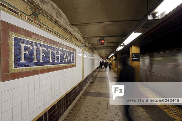 Subway station and train in motion  Manhattan  New York City  New York  United States of America  North America
