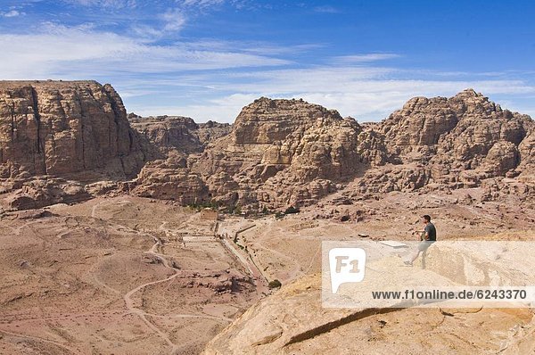 Traveller enjoying the view over Petra  UNESCO World Heritage Site  Jordan  Middle East