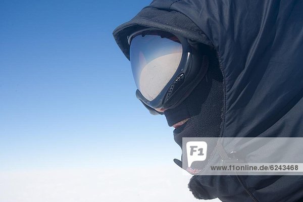 Portrait of polar explorer dressed for Arctic conditions  inland ice  Greenland  Polar Regions