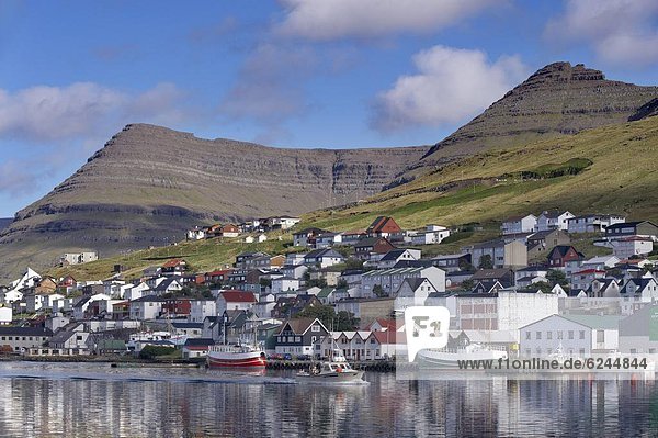 Fishing boats in Klaksvik harbour and views of Klaksvik  the second largest town in the Faroes  Bordoy Island  Nordoyar  Faroe Islands (Faroes)  Denmark  Europe