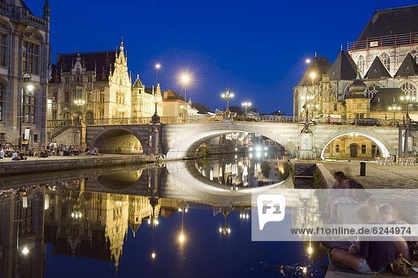 Reflection of arched bridge and waterfront town houses  Ghent  Flanders  Belgium  Europe