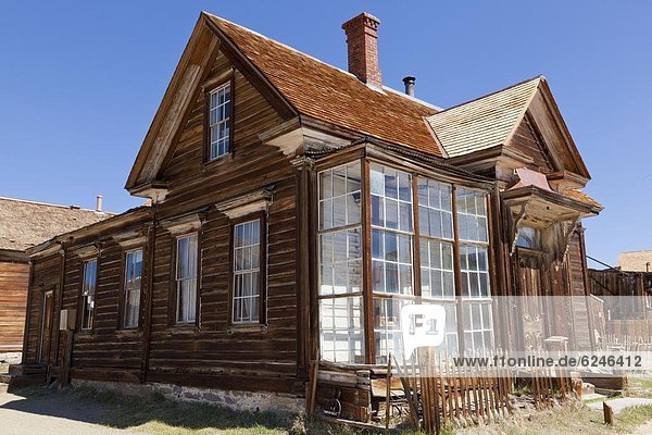 Glass fronted house of J S Cain the principal property owner in the California gold mining ghost town  Green Street  Bodie State Historic Park  Bodie  Bridgeport  California  United States of America  North America