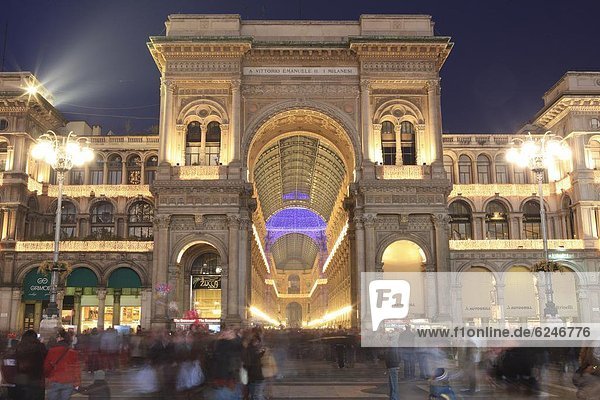 Galleria Vittorio Emanuele entrance illuminated at dusk  Milan  Lombardy  Italy  Europe