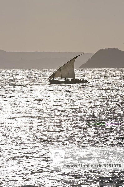 Small sailing boat at sunset near Diego Suarez (Antsira00)  Madagascar  Indian Ocean  Africa