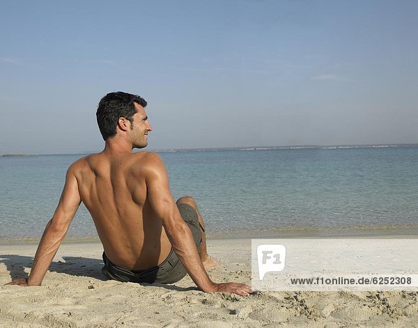 Man sitting on beach