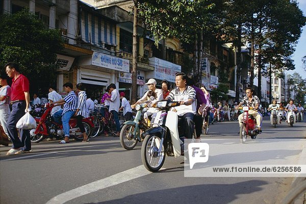 Motorbikes on Le Loi Boulevard in downtown area  Ho Chi Minh City (formerly Saigon)  Vietnam  Indochina  Southeast Asia  Asia