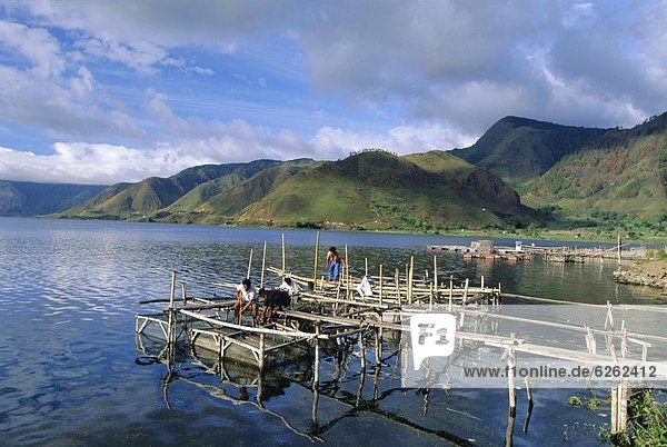 Fish rearing cages on northern tip of Lake Toba  the largest lake in SE Asia  Tongging  Lake Toba  Sumatra  Indonesia
