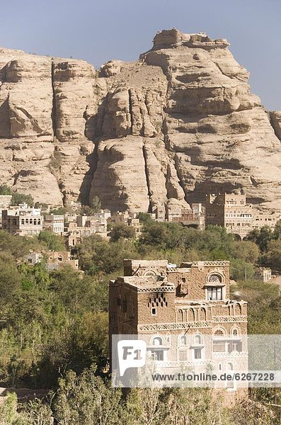 Gebäude Steilküste Ziegelstein Dorf groß großes großer große großen unterhalb bauen Naher Osten Sandstein Jemen