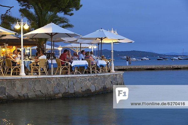 Waterfront restaurant in the evening  Port de Pollenca (Puerto Pollensa)  Mallorca (Majorca)  Balearic Islands  Spain  Mediterranean  Europe