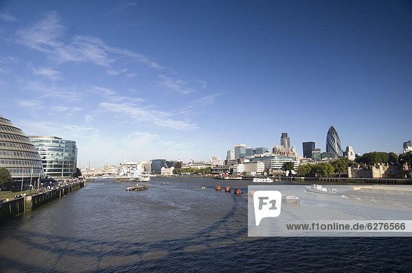 The River Thames  South Bank and City Hall on left  City of London on right  London  England
