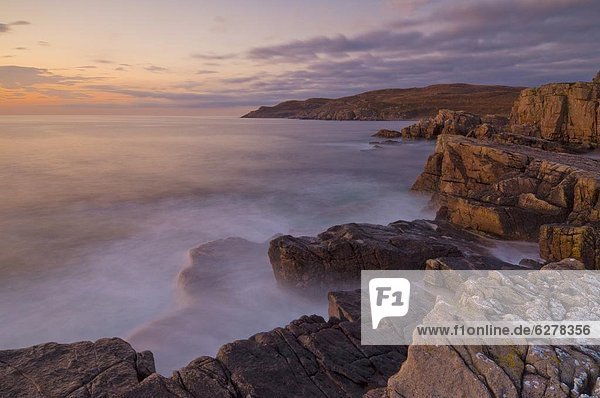 Sunset and incoming tide taken with a slow shutter speed  Mellon Charles  Wester Ross  Scotland  United Kingdom  Europe