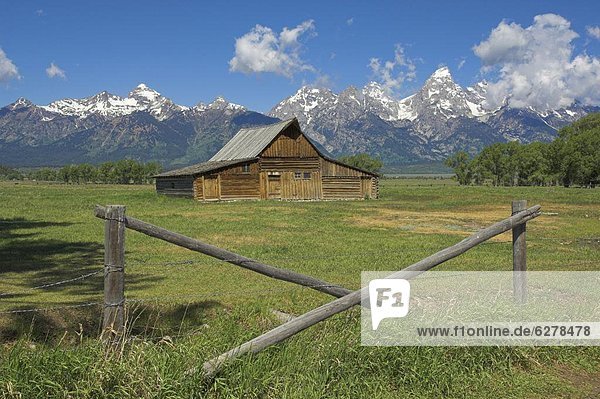 The Moulton Barn on Mormon Row with the Grand Tetons range in background  Antelope Flats Road  Grand Teton National Park  Wyoming  United States of America  North America