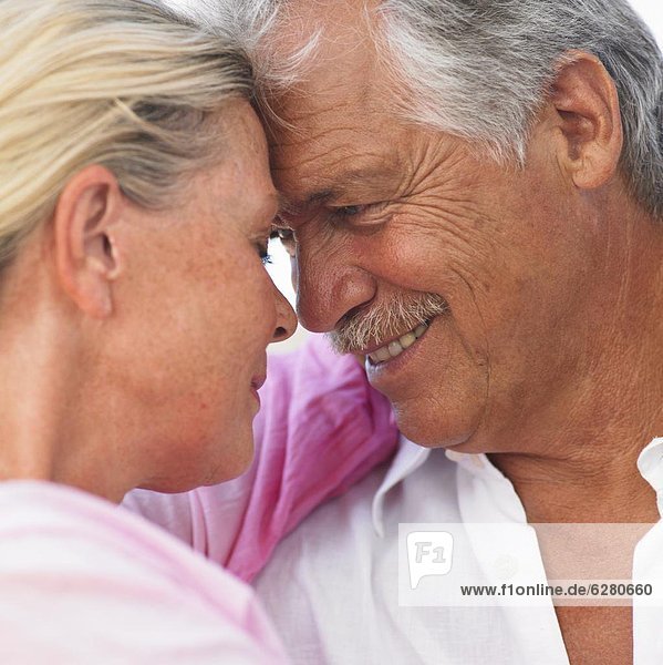 senior couple embracing outdoors  close-up