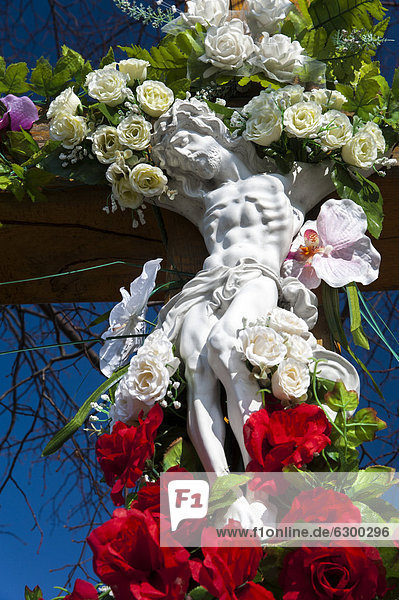 Crucifix decorated with flowers in Tarnow Lesser Poland Poland Europe