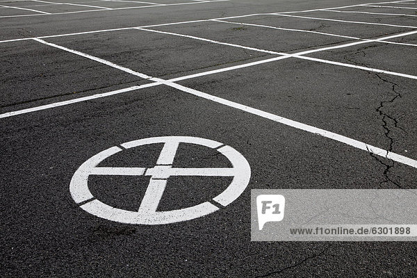 Free parking space with a no parking symbol  concept image for the lack of parking spaces