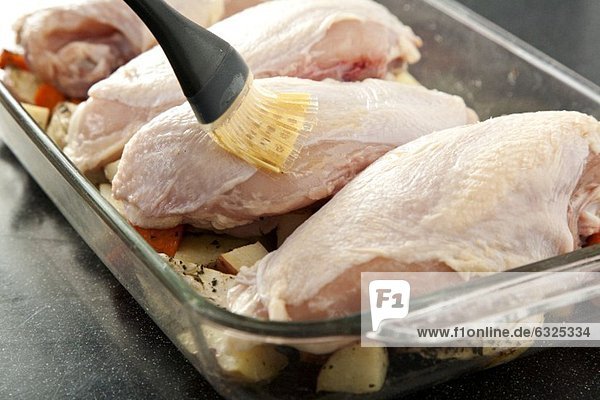 Basting Chicken Breast in a Roasting Dish