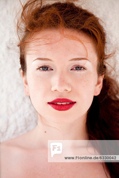 Young woman with red lipstick