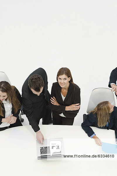 Businesswoman collaborating with colleague in meeting