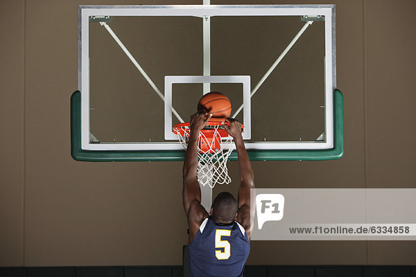 Basketball player making a basket