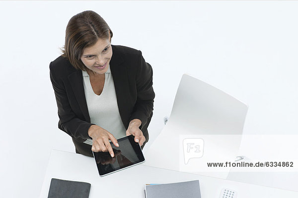 Businesswoman using digital tablet  high angle view