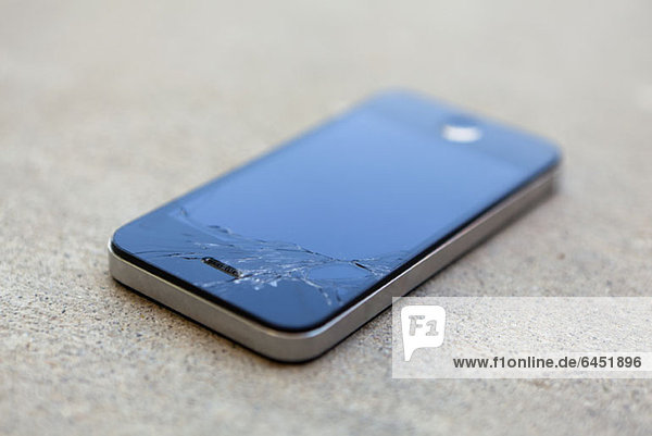 A smart phone with a cracked screen