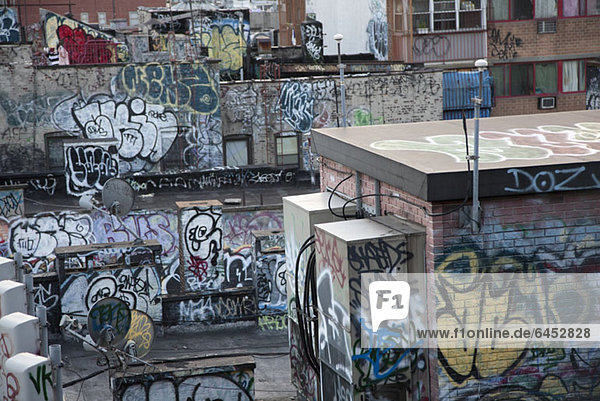 Graffiti covered tenement rooftop in Chinatown