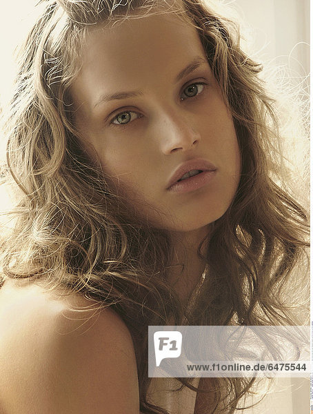1224776 indoor studio woman young girl 20-25 blonde lock locks long hair sad sadness dream portrait close up think vertical