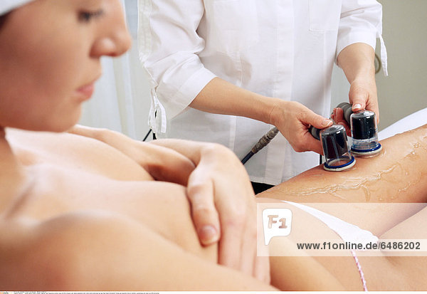 1221934 indoor parlour beauty women fragment hand beautician woman young 25-30 sit beauty care naked nakedness body white pants underwear leg legs thigh thighs anticellulitis firming spm operation device cosmetic cosmetology gel close up profile horizontal