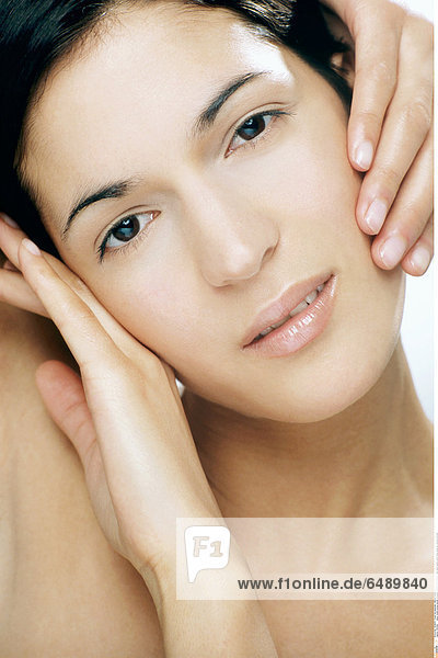 1231946 indoor studio young woman brunette people 25-30 beauty care hand hands touch face close up vertical portrait