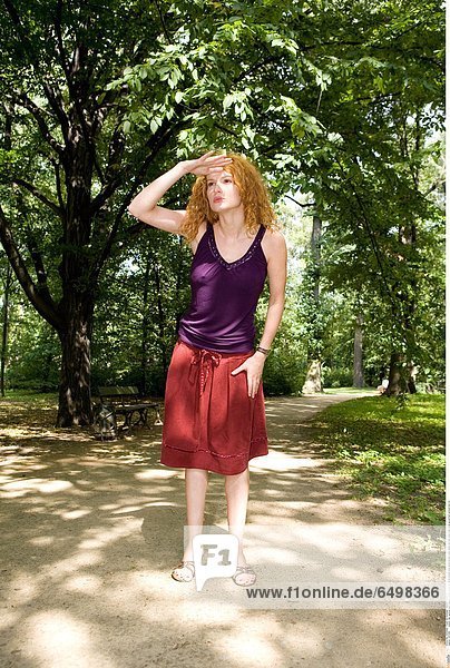 1247286 outdoor day summer park people woman young girl 20-25 blonde long haired blouse violet dress red rest relax walk close up portrait vertical look for