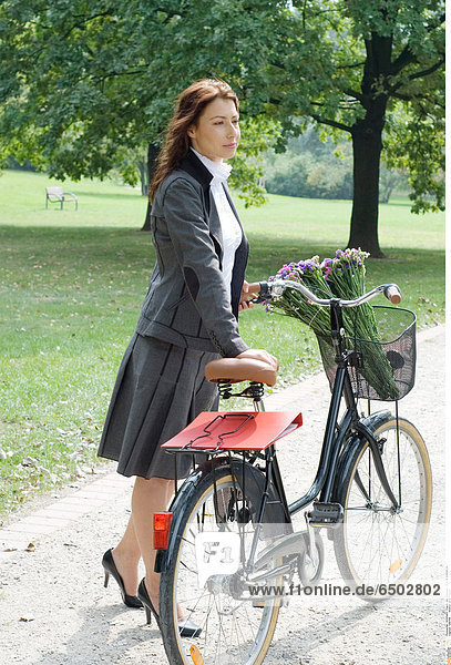 1260108 Woman on a bicycle.