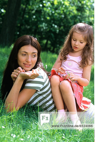 Mother with daughter in the garden.