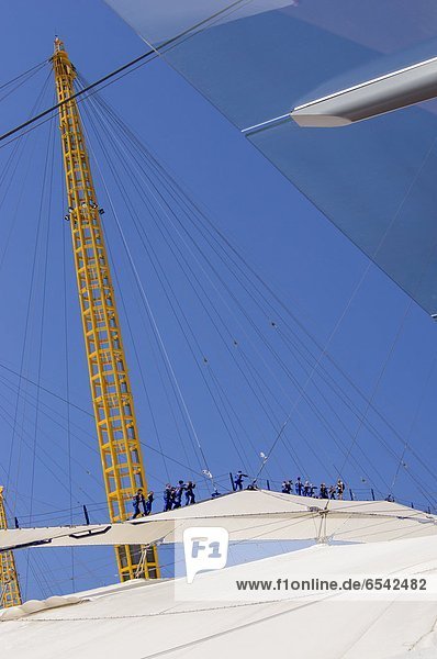 Tourists climbing on roof of Millennium dome  Greenwich  London  England  Great Britain  Europe