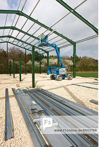 Mandatory Credit: Photo by Tim Scrivener / Rex Features ( 1334354cg ) Men constructing a new on farm grain store Lincolnshire England Britain Various