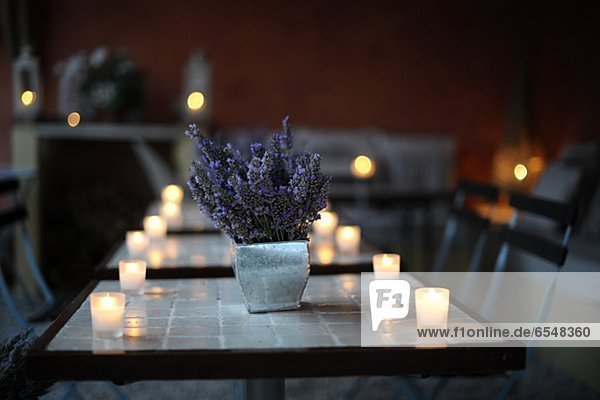 Restaurant table with lavender and candlelight
