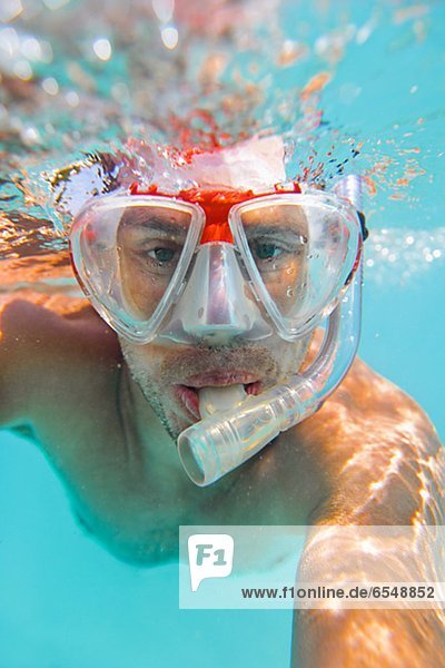 Underwater portrait of man diving