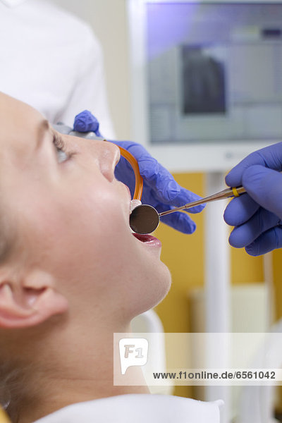 Germany  Brandenburg  Strausberg  Dentist examining patients teeth