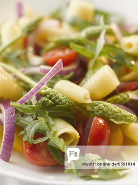 Plate of pasta salad with campanelle and wild asparagus  close up