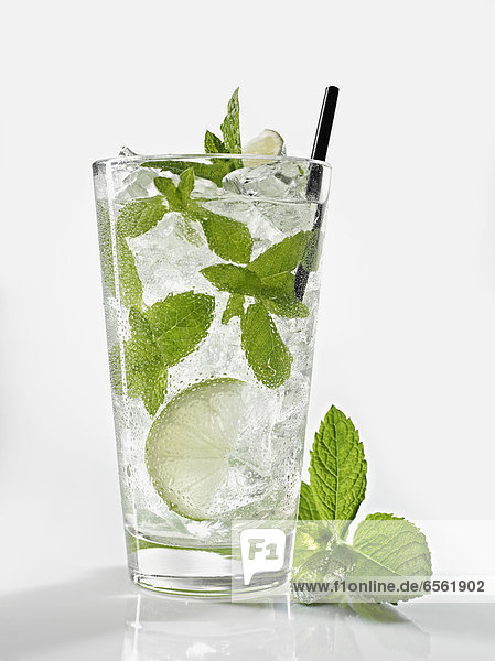 Glass of mojito with mint on white background  close up