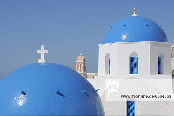 Greece  View of classical whitewashed church and bell tower at Oia